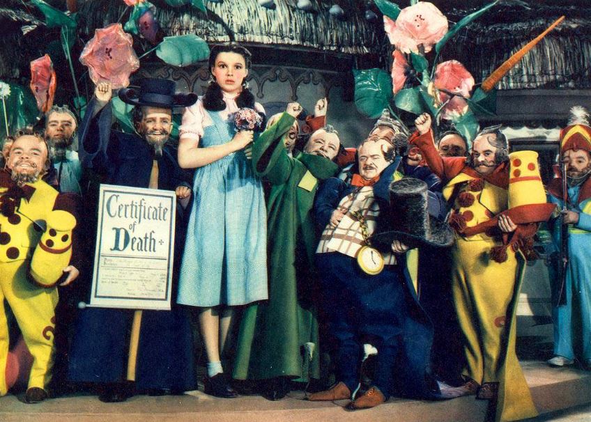The Wizard of Oz characters, huge pink flowers, Certificate of Death poster