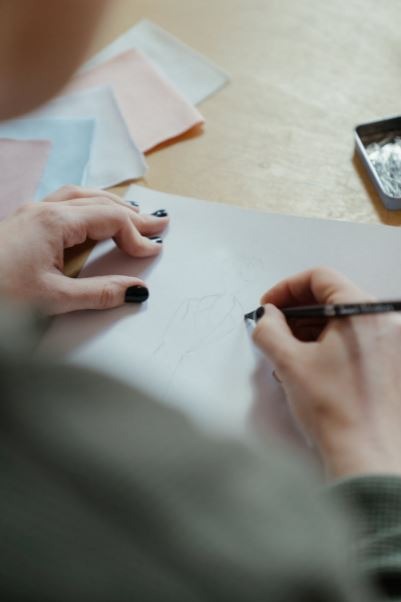 person drawing on paper